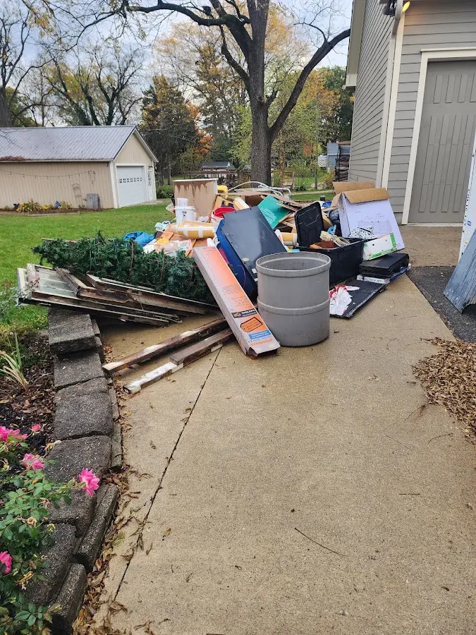 Dumpster being loaded with debris for 3 Yard Dumpster Rental in Haddonfield